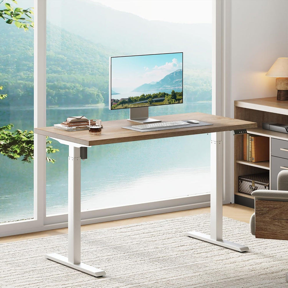 Front three-quarter view shows a rectangular wood-tone desktop on two white T-shaped legs