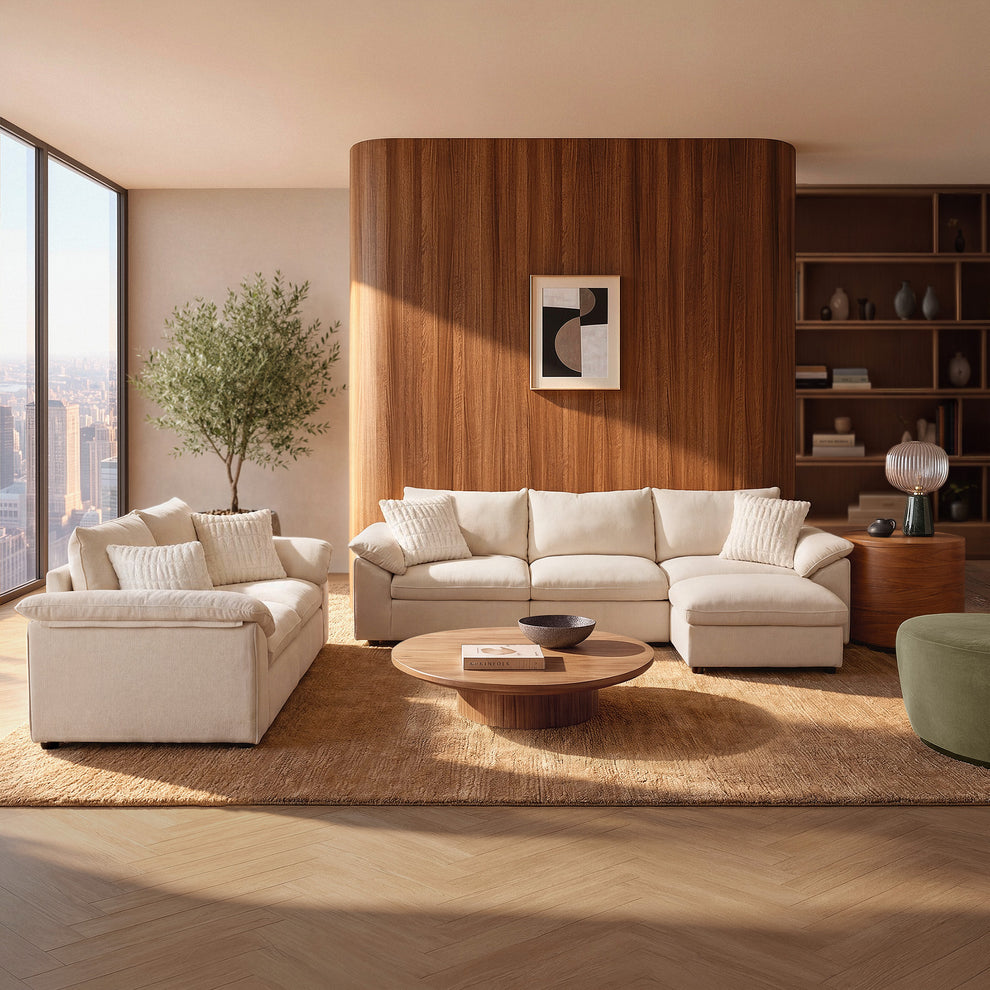 Beige L-shaped sofa and loveseat arranged in a sunlit modern living room.