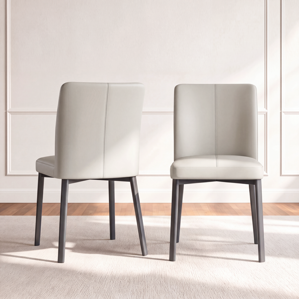Front and rear views show a light upholstered dining chair with a center back seam and dark tapered legs