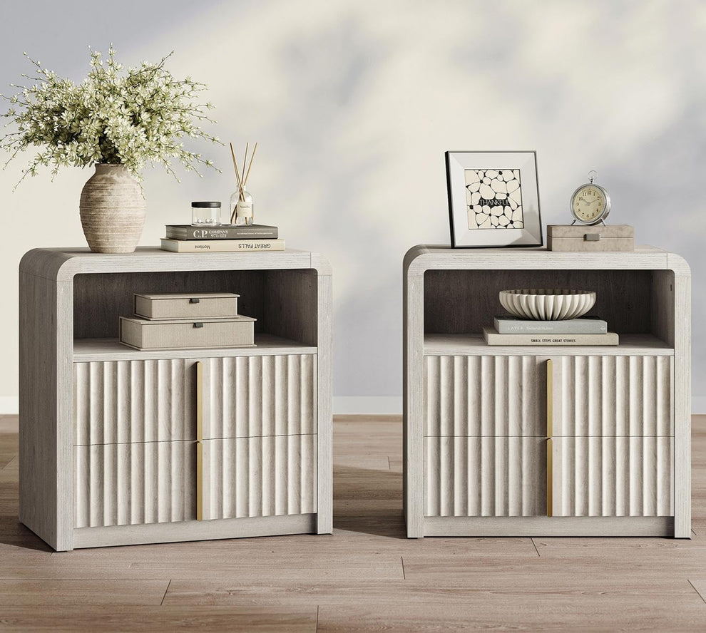 Two pale wood-grain nightstands with open cubbies, fluted drawers and rounded top corners arranged side by side
