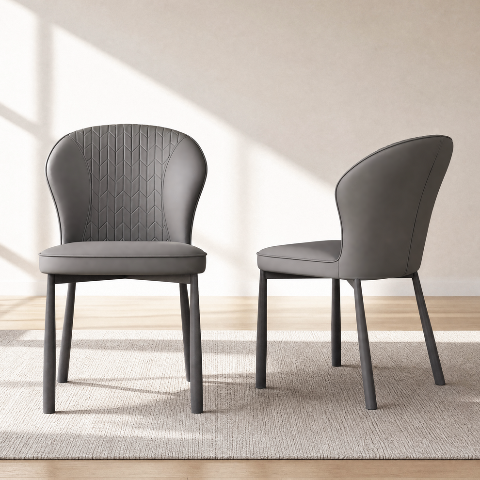 Two gray dining chairs with winged backs and geometric stitching, shown from the front and side