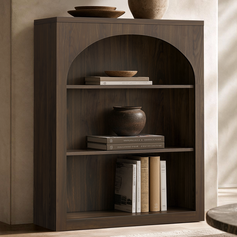 Dark wood-grain bookshelf with an arched opening and three shelves displaying books and pottery