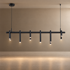 Black pendant light suspended by two cables, with a long horizontal bar and curved tubular arms ending in glowing tips at staggered heights.