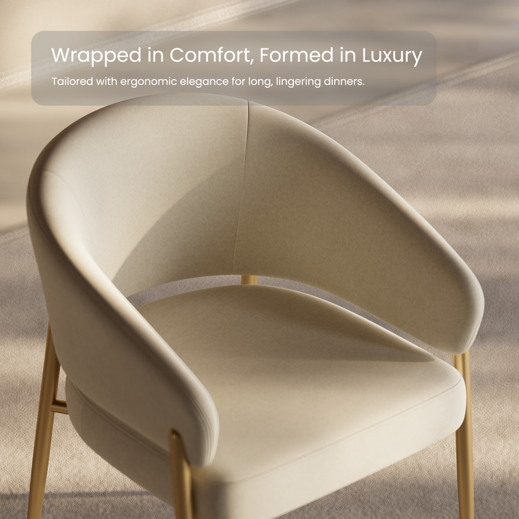 Cream upholstered dining chair with a curved back and gold-tone legs.
