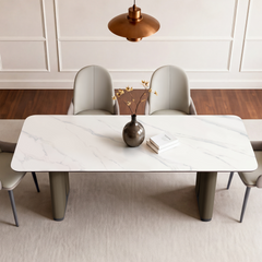 Overhead view of a rectangular dining table surrounded by four chairs