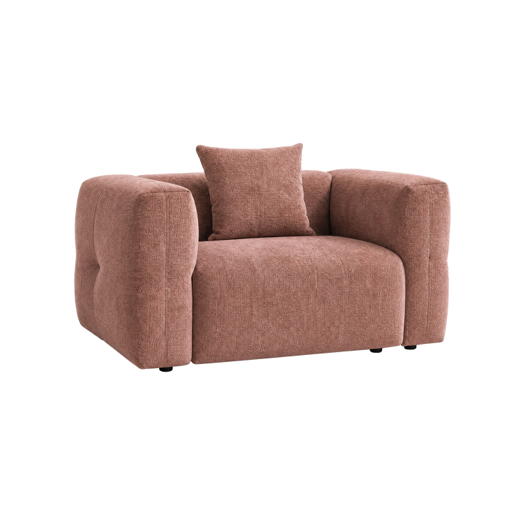Pink upholstered armchair with wide rounded arms and a matching square cushion.