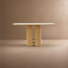 Light wood table with a pale oblong top and split pedestal base.