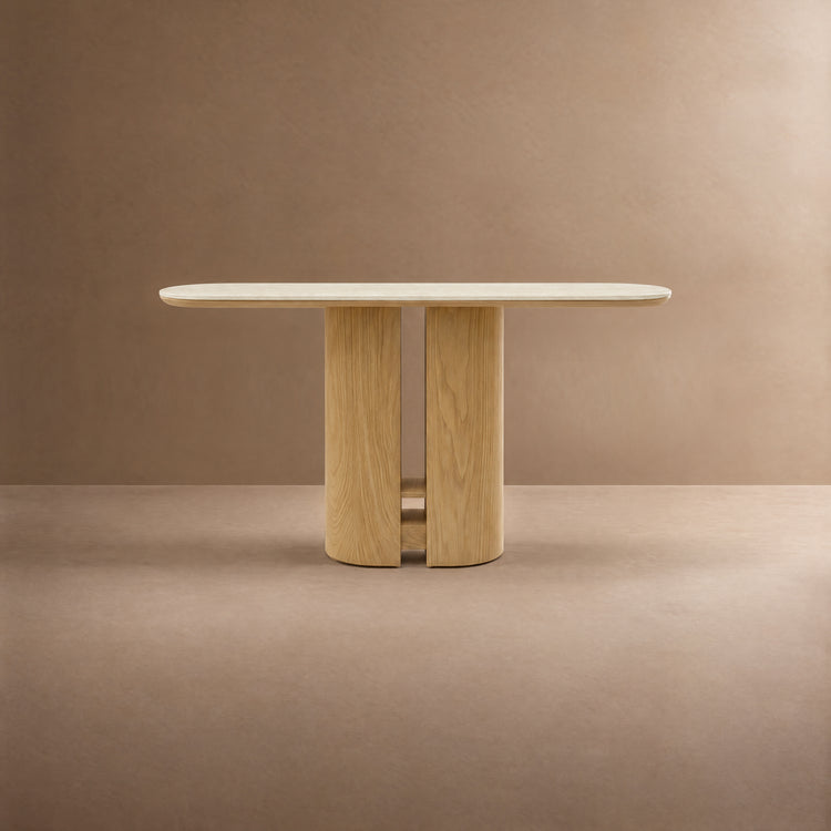 Light wood table with a pale oblong top and split pedestal base.