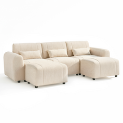 Cream-colored three-seat sofa with rounded arms, three rectangular pillows, and two matching ottomans on short black feet against a white background.