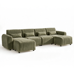 Olive-green sofa with four rectangular pillows, rounded arms, short black feet, and two matching ottomans positioned in front of the outer seats.