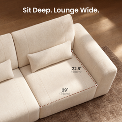 Overhead view of a cream upholstered sofa seat with dashed measurement lines labeled 22.8 inches (58 cm) and 29 inches (74 cm).