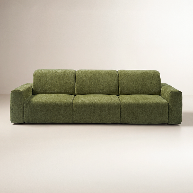 Front view of an olive-green sofa with three seat cushions, three back cushions, and broad padded arms against a plain cream background.