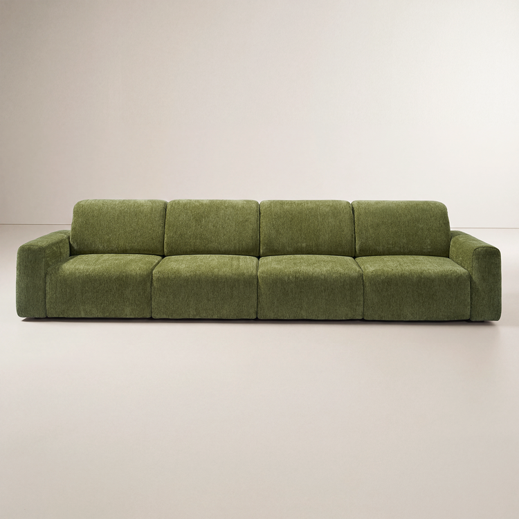 Olive green sofa with four seat cushions, four back cushions, and low rectangular arms, shown from the front against a plain cream background.