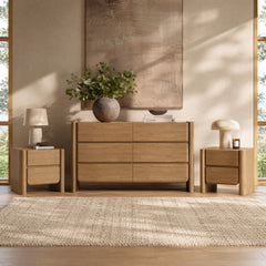 A six-drawer dresser stands between two matching two-drawer nightstands