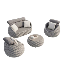 The seating group includes one sofa, two rounded chairs, and a round low table with braided outer frames
