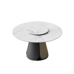 The round tabletop includes a smaller raised circular disk at its center and rests on a dark sculptural pedestal base