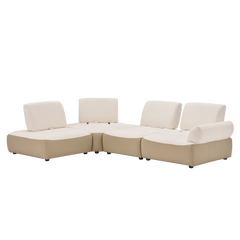 Curved beige sectional sofa with white cushions and matching back pillows.