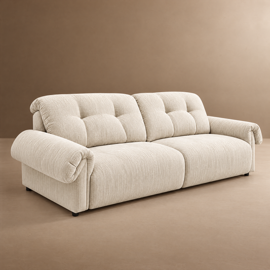 Cream upholstered sofa with tufted cushions and wide rolled arms