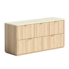 A light wood dresser with three wide handleless drawers and rounded vertical edges appears on white
