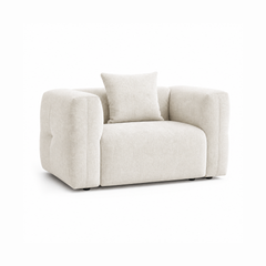 Off-white upholstered armchair with broad rounded arms and a matching back cushion.