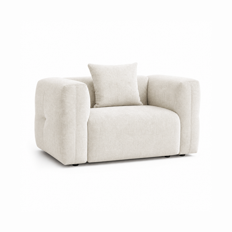 Off-white upholstered armchair with broad rounded arms and a matching back cushion.