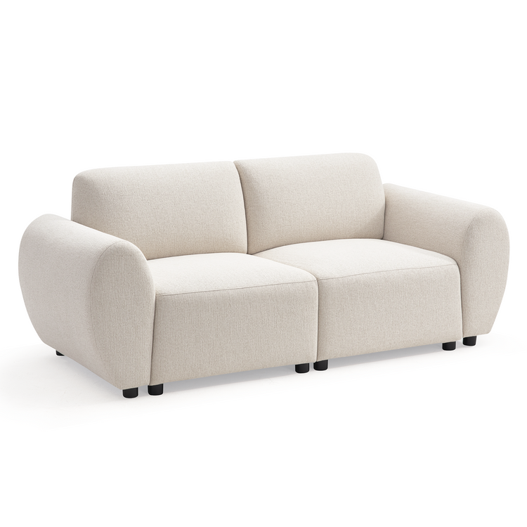 Cream-colored sofa with two seat cushions, two back cushions, broad rounded arms, textured upholstery and short black feet, shown at an angle against a white background.