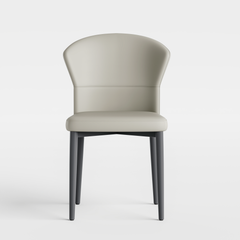 Light chair has a curved wraparound back, padded seat, and four dark tapered legs