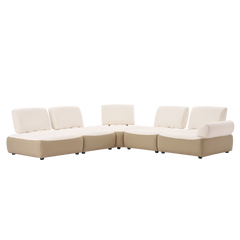 Curved modular sectional sofa with cream cushions and beige bases