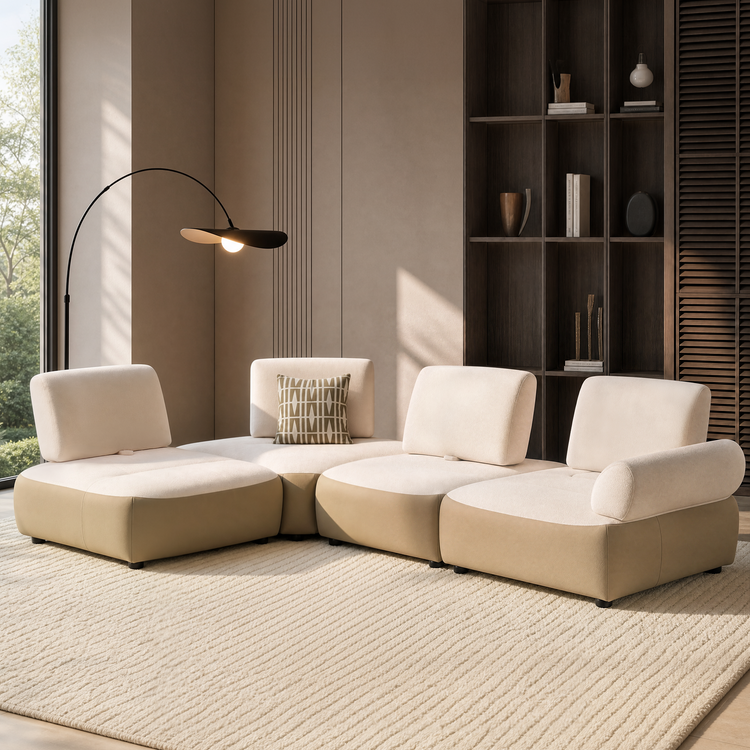 Cream modular sectional seating with rounded tan bases in a sunlit modern room.