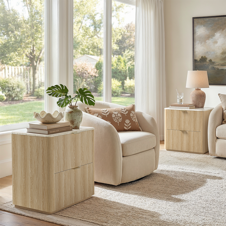 Two matching light wood-look drawer tables flank cream living-room seating