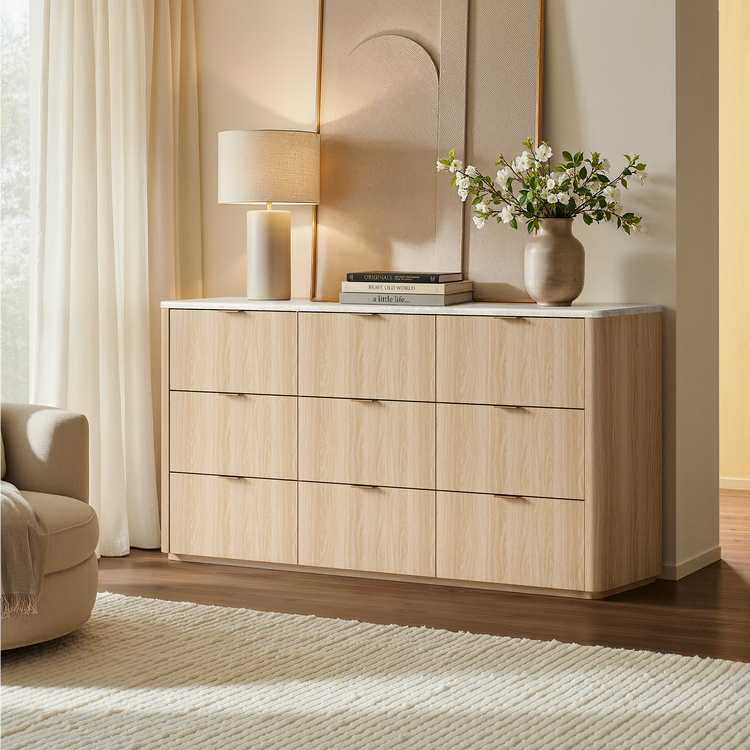 Light wood-toned dresser shown in a bedroom