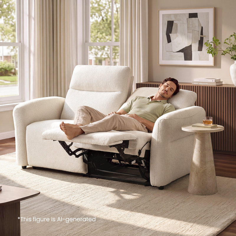 Man resting on a beige textured loveseat with one footrest extended.