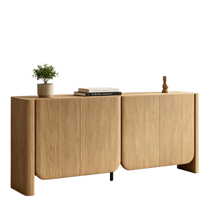 A four-door wood-grain sideboard with rounded lower corners is topped by a plant, books, and a small sculpture