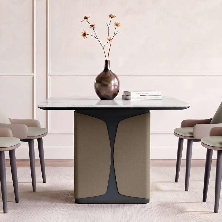 A rectangular dining table with a central pedestal is surrounded by four chairs