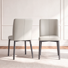Front and rear views show a light upholstered dining chair with a center back seam and dark tapered legs