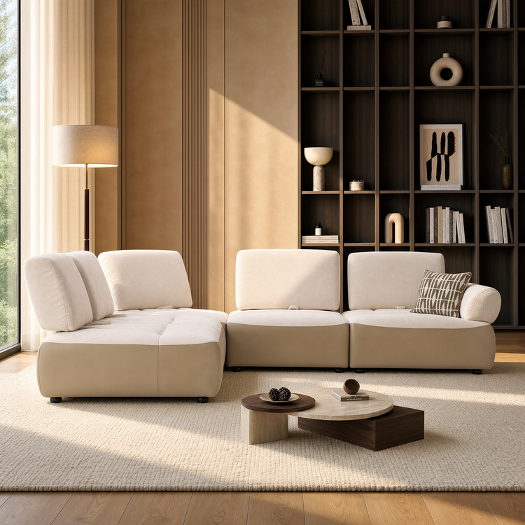 Cream sectional sofa in a sunlit living room with dark built-in shelves.