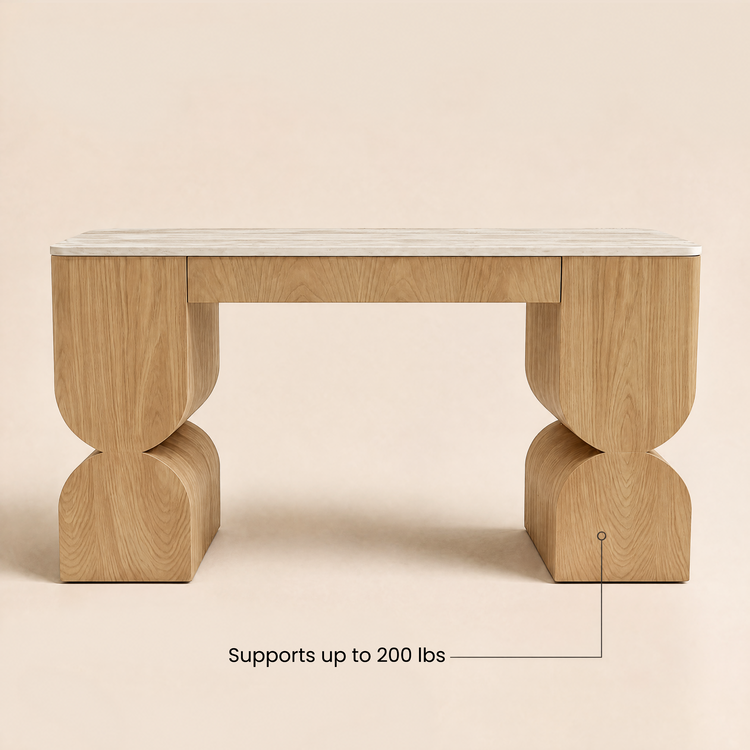 Wood desk with sculptural curved legs and a pale stone top.
