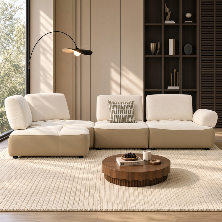 Cream and tan modular sectional sofa with chaise in a sunlit modern living room.