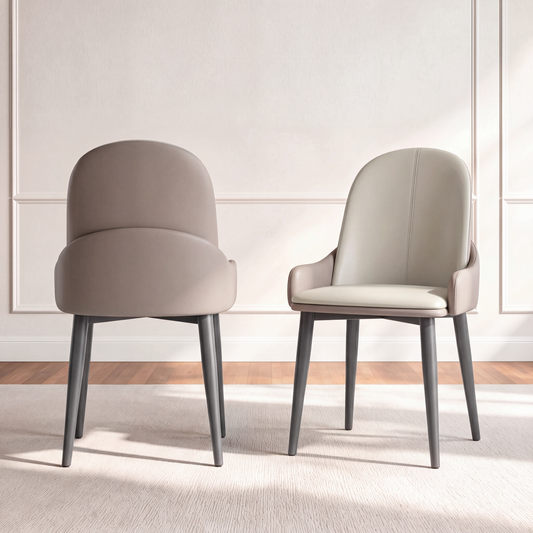 Two gray dining chairs with rounded backs, wraparound side panels and dark tapered legs, front and rear views