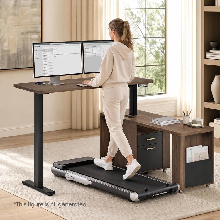 A woman walks on a treadmill beneath a standing desk with two monitors in a home office.