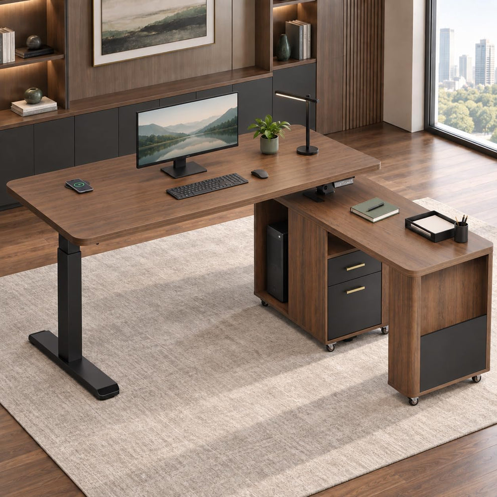 A wood desk with a black monitor, keyboard, mouse, and lamp stands beside a wheeled matching cabinet with drawers in a modern office.