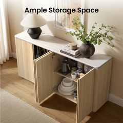 Open cabinet doors reveal bottles, drinkware, a kettle, cups, and stacked dishes