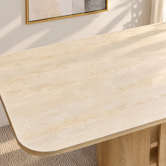 Close-up of a pale stone-patterned tabletop with a rounded wood edge.
