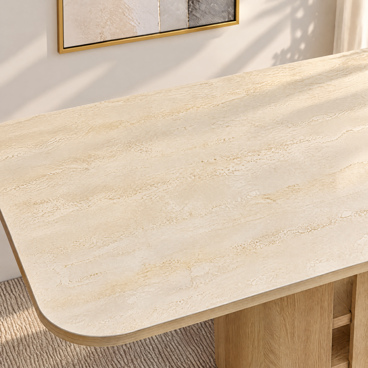 Close-up of a pale stone-patterned tabletop with a rounded wood edge.
