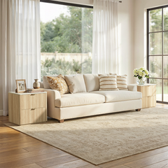 Cream sofa with side tables shown in a living room