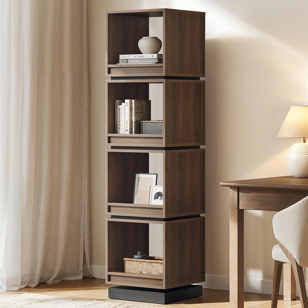 Four open dark wood cube shelves are stacked vertically and styled with books, framed art, a basket, and small decor