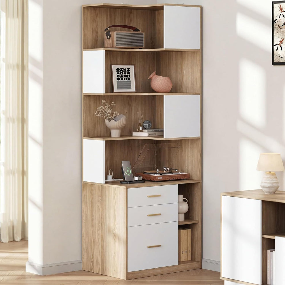 Tall light wood-grain shelving unit with white doors and drawers displays a turntable, books, vases, and small electronics
