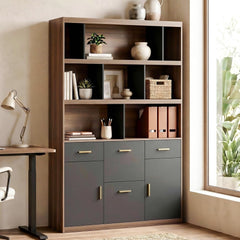 Wood storage cabinet with open shelves, gray doors and drawers, styled in a home office.