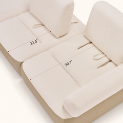 Two cream sofa seats with dotted dimension lines across the cushions.
