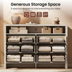 Wide pale storage chest shown open with six compartments filled with folded clothing and linens
